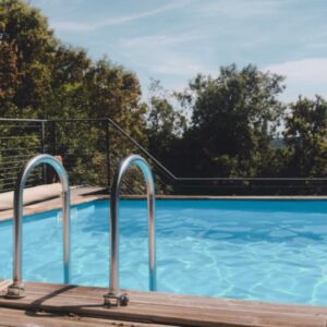 Swimming pool with railing and trees